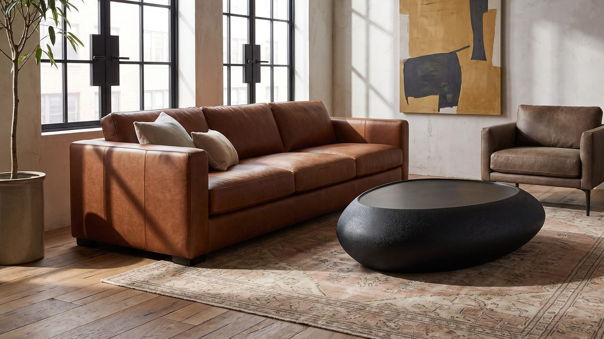 Black stone, set low. - Scicli Black Fiberglass Pebble Coffee Table