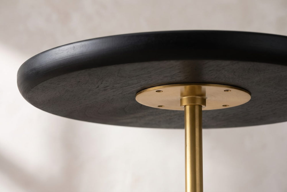 A tray top on a gold rod