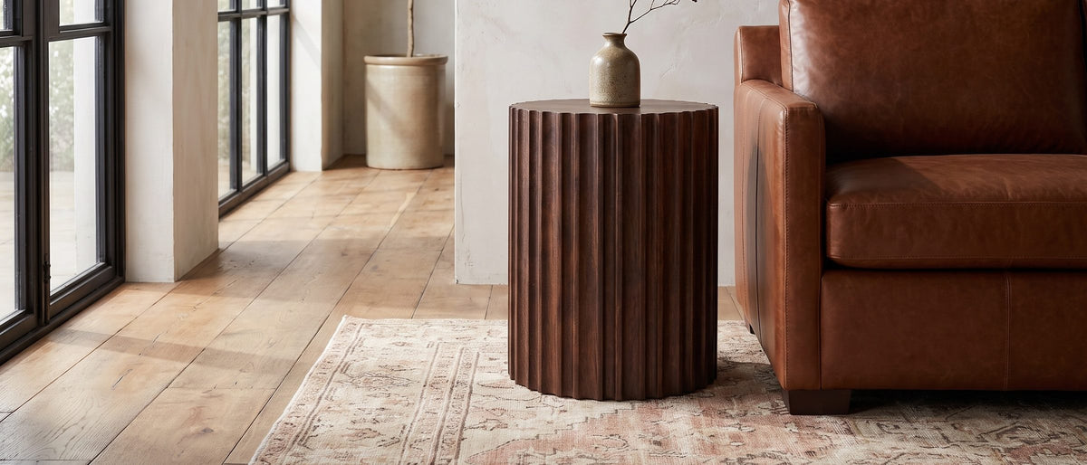 Senise Walnut Mango Fluted Drum Side Table in the room