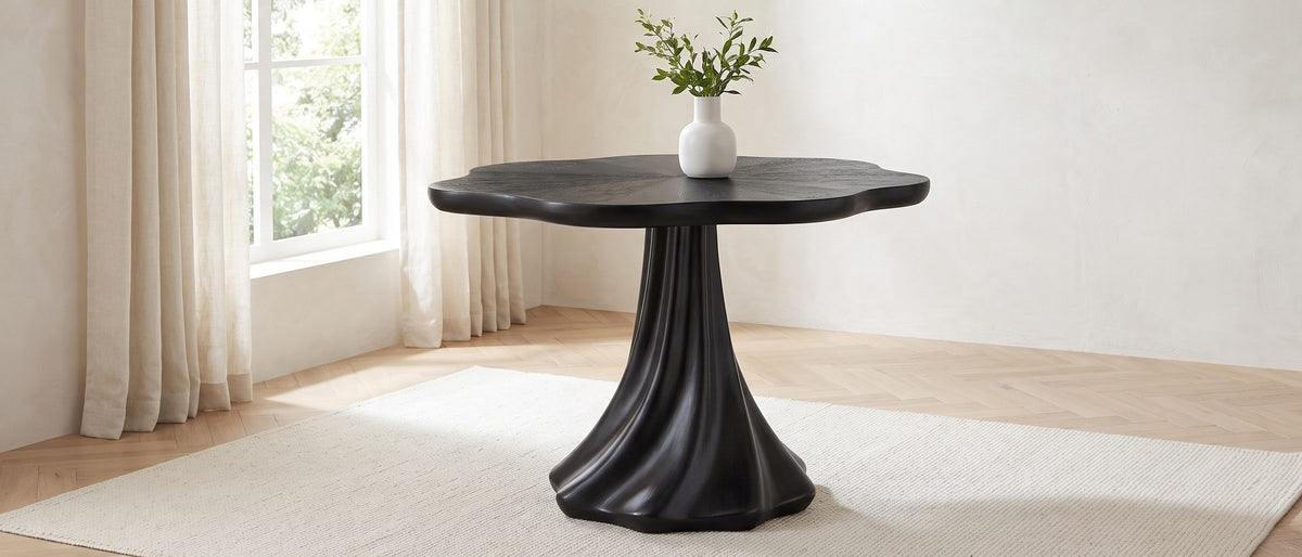 Spilimbergo Black Fiberglass Twisted Petal Pedestal Dining Table in the room