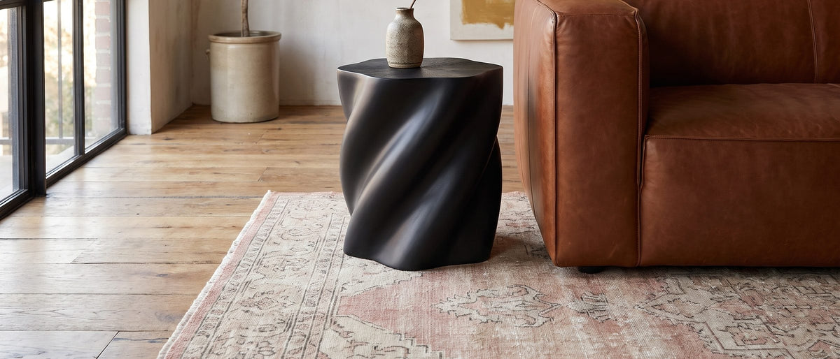 Spilimbergo Black Fiberglass Twisted Petal Side Table in the room