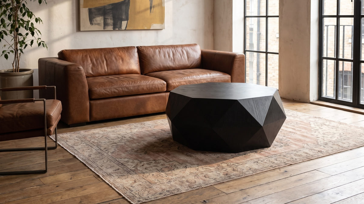 Light across black facets. - Taranto Black Faceted Drum Coffee Table