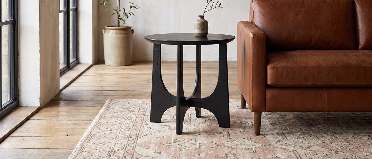 Taviano Black Wood Veneer Round Side Table in the room
