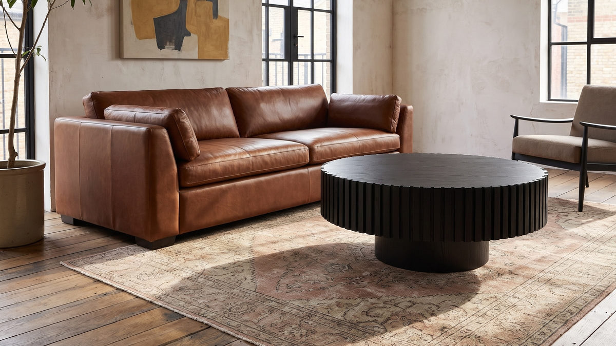 Black, round, and textured. - Terni Black Wood Veneer Fluted Pedestal Coffee Table