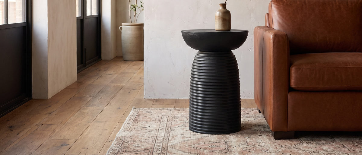 Tursi Black Mango Ribbed Pedestal Side Table in the room