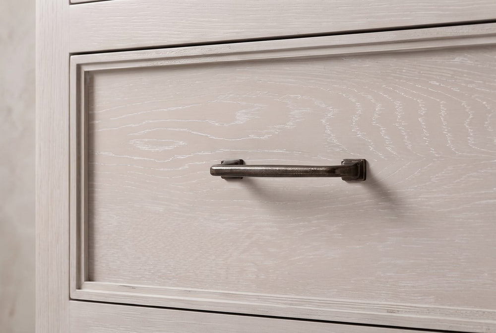 A bar pull on a framed drawer