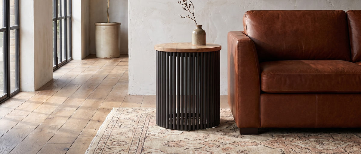 Viggiano Mango and Black Metal Drum Side Table in the room