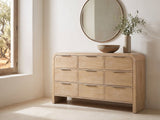 Aquileia 63-Inch Natural Mango 9-Drawer Dresser under a round bronze mirror in a villa bedroom