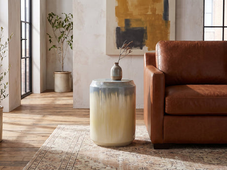 Aradeo Reactive Glaze Ceramic Drum Side Table beside a leather sofa in an industrial loft