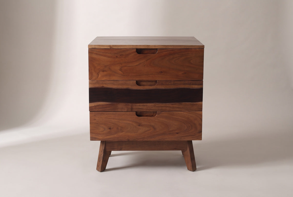 The Arborea nightstand in walnut-brown acacia, front view on a light studio backdrop