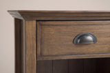 The drawer of the Arbus nightstand: a framed drawer front in aged brown with an antique-finish metal cup pull, the crown moulding above