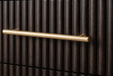 A reeded espresso drawer front of the Aritzo nightstand with its slim gold-finish bar pull standing off the reeds