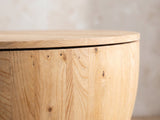 Close-up of the Arona 31.5-Inch Round Solid Fir Storage Drum Coffee Table: the lift-off fir lid resting on the rim of the stave drum