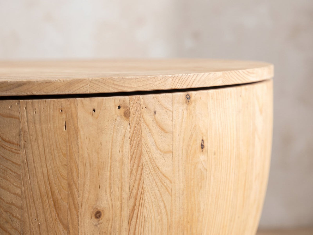 Close-up of the Arona 31.5-Inch Round Solid Fir Storage Drum Coffee Table: the lift-off fir lid resting on the rim of the stave drum