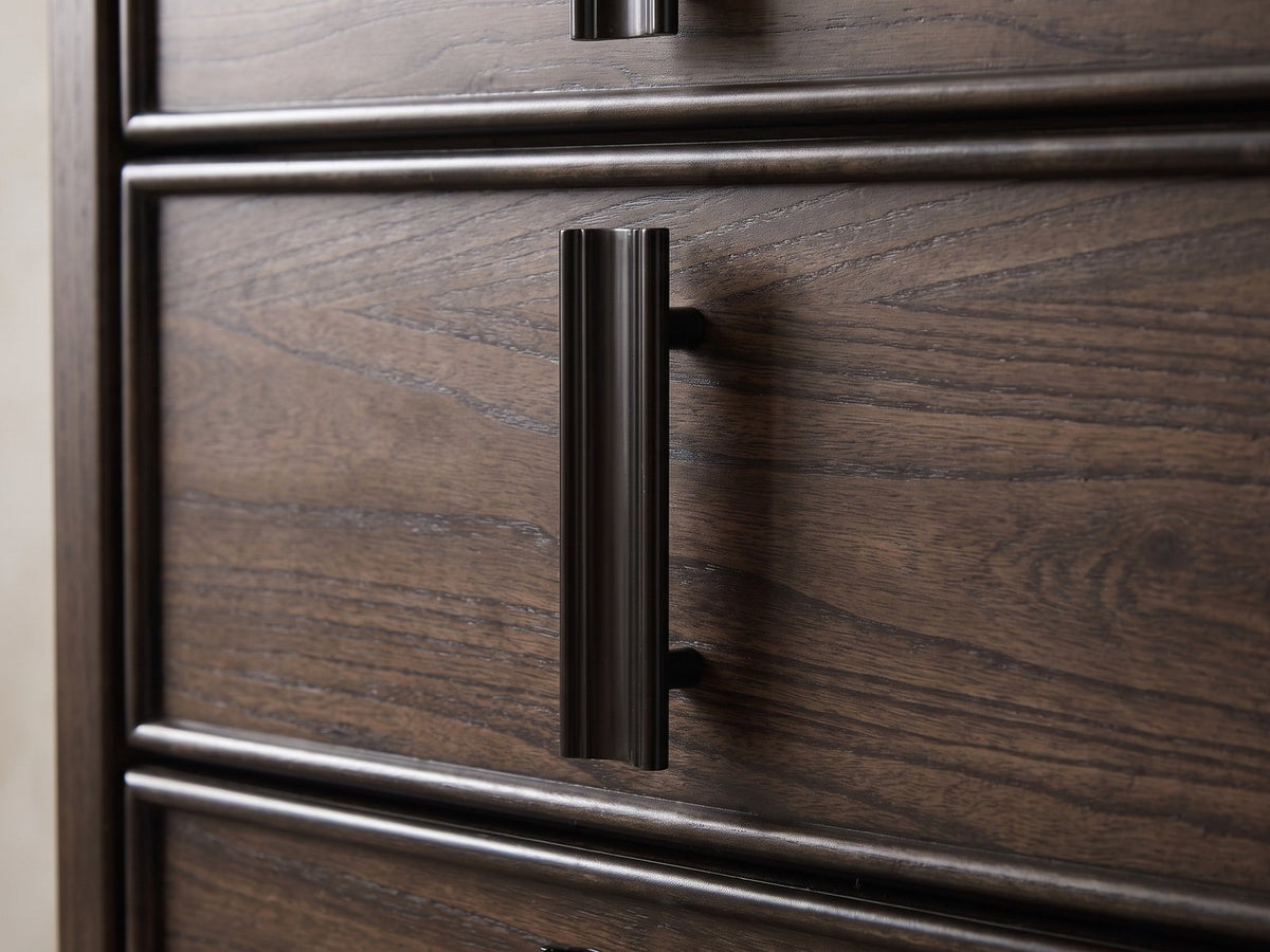 Close-up of the Arta 61-Inch Dark Brown 6-Drawer Dresser: a near-black reeded vertical pull on a moulded drawer front