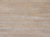 Close-up of the Asiago 40-Inch Square Faux Travertine Pyramid Pedestal Dining Table: the pitted, matte travertine-look texture of the top