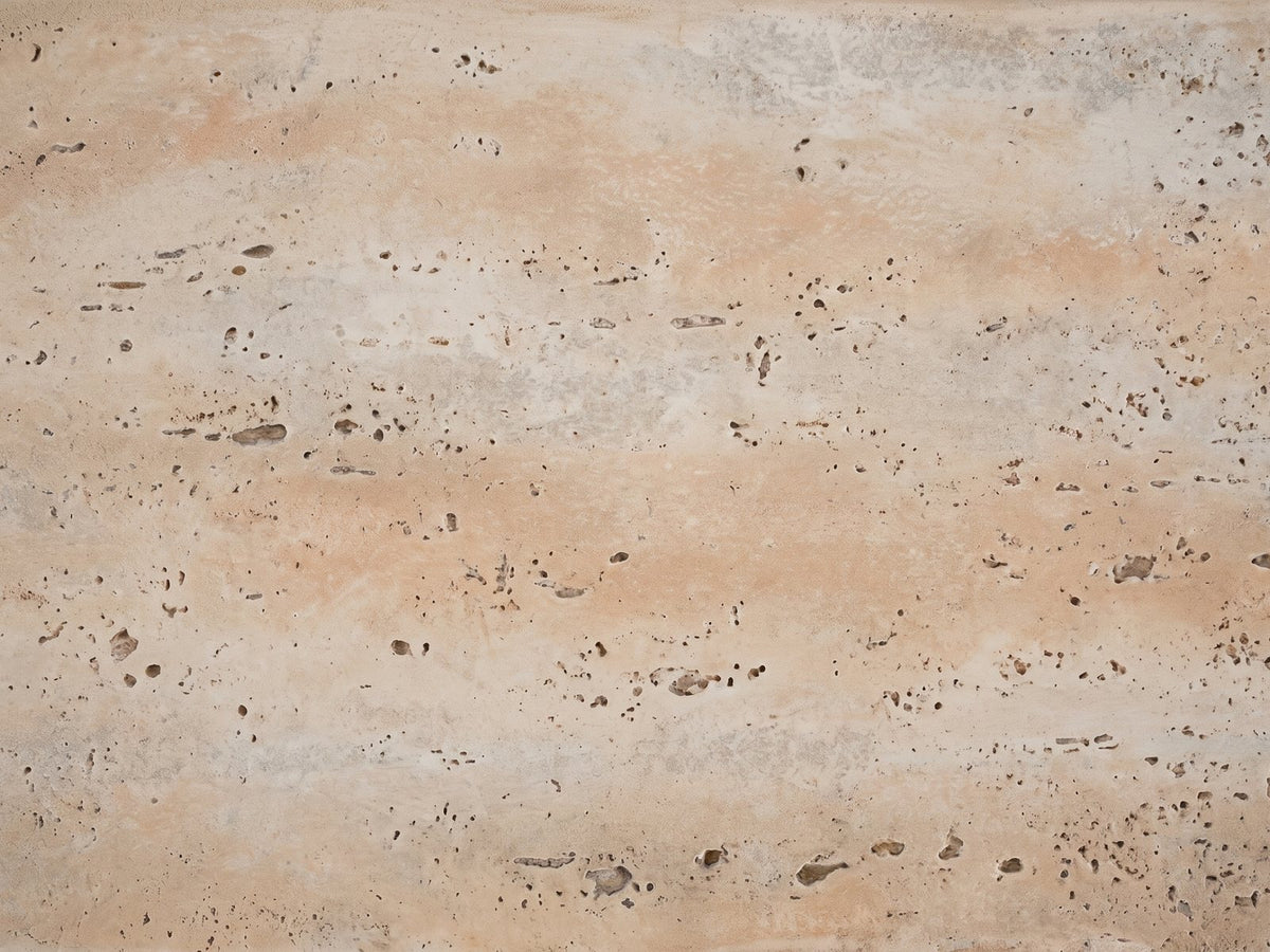Close-up of the Asiago Faux Travertine Arched Console Table: the pitted, matte travertine-look texture of the magnesium oxide surface
