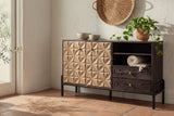 Atella carved pyramid-relief sideboard in a Santa Barbara living room with a white-washed stucco wall, terracotta tiles and a glass door at the left