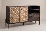 The Atella sideboard with two sand-colored carved doors, open cubbies and two espresso drawers on a black metal base, three-quarter view on a light studio backdrop