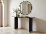 Atina Black Ash Oval Console Table under a round mirror in a travertine entryway