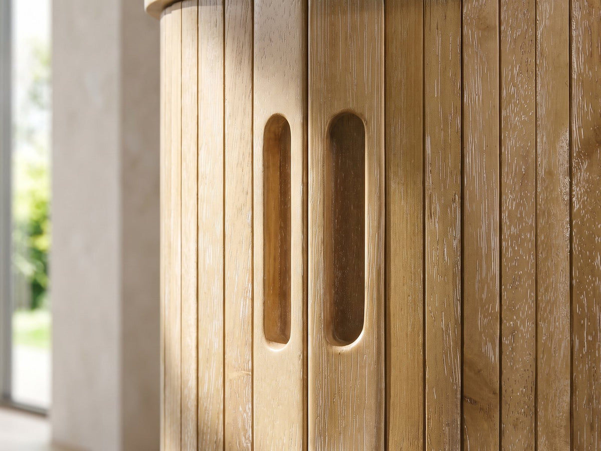 Close-up of the Atrani Reeded Curved Media Console: the reeded door front with two carved finger pulls