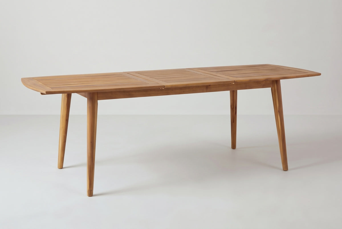 The Augusta dining table extended to 94.5 inches with its slatted center piece in place between the two halves, three-quarter view