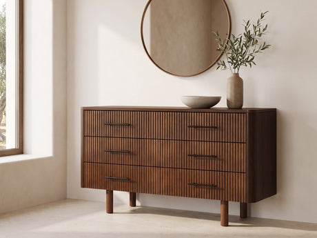 Badia 56-Inch Walnut-Finish 6-Drawer Dresser under a round bronze mirror in a villa bedroom