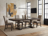 Bagnara 76.5 to 94.5-Inch Rustic Oak Double Pedestal Dining Set with 4 Chairs in an industrial loft dining area