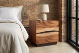 Barumini suar nightstand against an exposed brick wall in a Chicago loft bedroom with a black steel window and a concrete floor