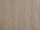 Close-up of the Bassano 65-Inch Wire-Brushed Driftwood Gray 7-Drawer Dresser: the lightly wire-brushed gray-taupe birch veneer