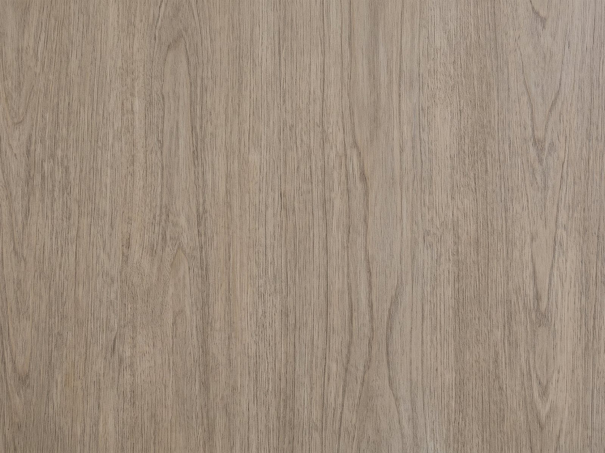 Close-up of the Bassano 65-Inch Wire-Brushed Driftwood Gray 7-Drawer Dresser: the lightly wire-brushed gray-taupe birch veneer