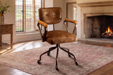 Belcastro Top-Grain Leather Swivel Desk Chair with Wood Arms in an English country study