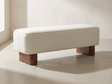 Bellagio Walnut Block Bench in ivory against a plaster wall in morning light