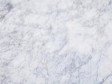Close-up of the Bellegra White Marble Console Table: the grey-lavender veining of the white marble top