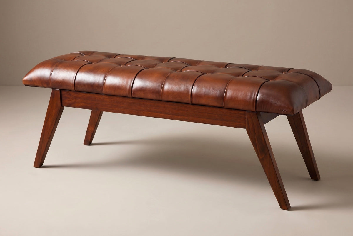 The Bevagna bench with its cognac leather cushion, three-quarter view on a light studio backdrop