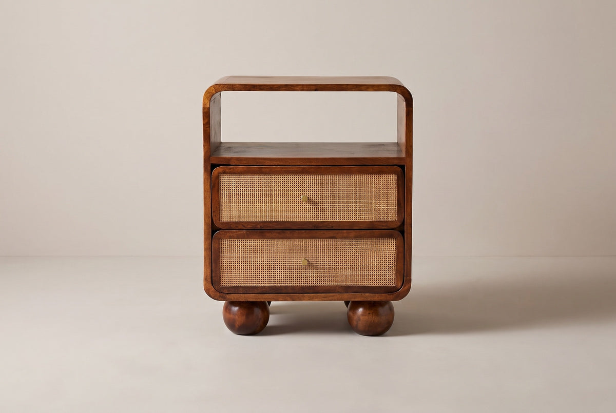The Bitti nightstand in chestnut mango, front view on a light studio backdrop