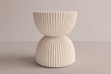 The Bivona side table from the side: a ribbed upper bowl under the round top, a narrow waist at mid-height and a ribbed lower bowl down to the base