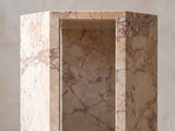Close-up of the Bojano Rosa Marble Hexagon Side Table: an open side of the hexagon framed by polished marble edges