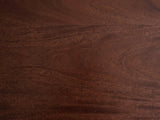 Close-up of the Bolgheri Sculpted Mango Coffee Table: the wine-brown mango grain of the top