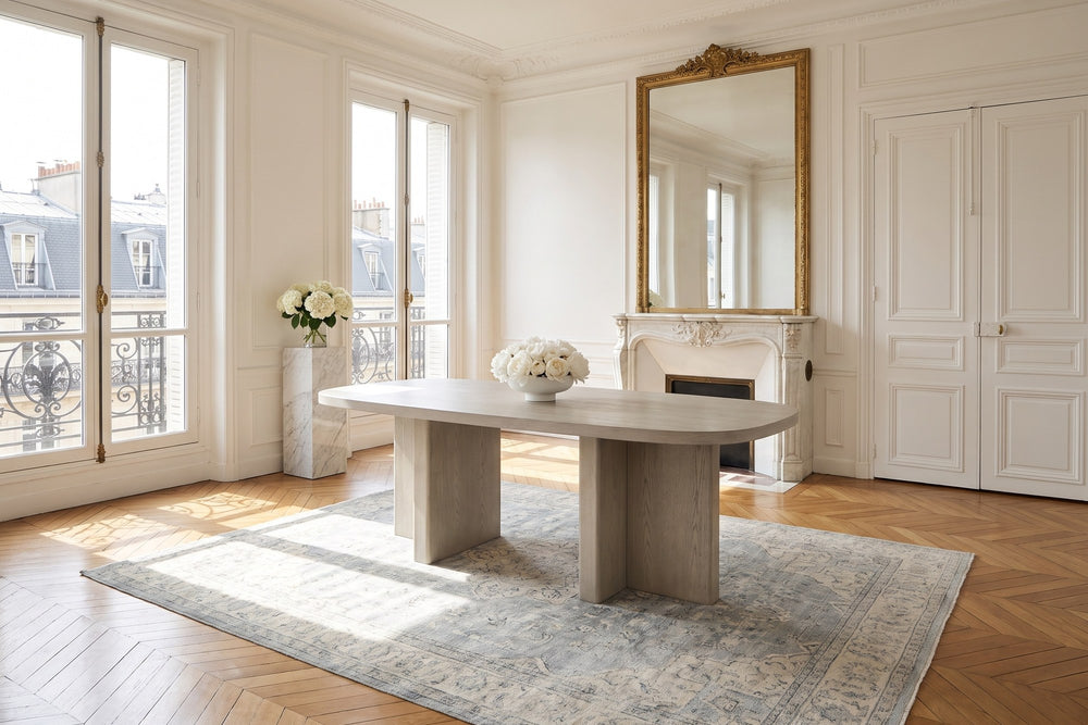 Bova 82-Inch Oval Grey Oak Veneer Dining Table in a Paris salon