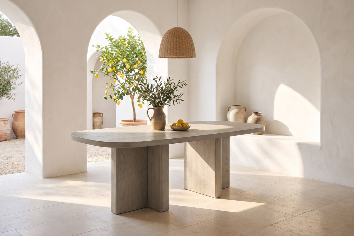 Bova 82-Inch Oval Grey Oak Veneer Dining Table in a courtyard dining room