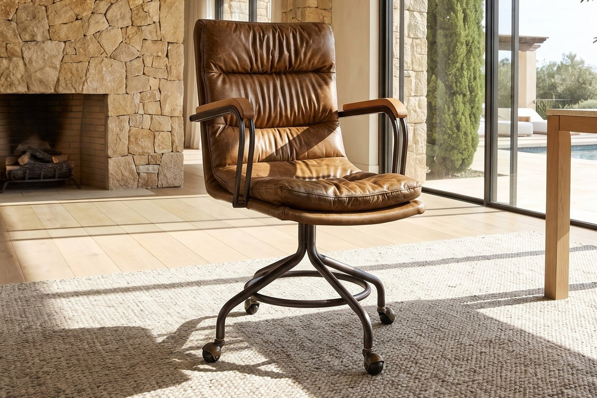 Bovalino Pillowed Top-Grain Leather Swivel Desk Chair with Wood Arms in a sunlit villa study