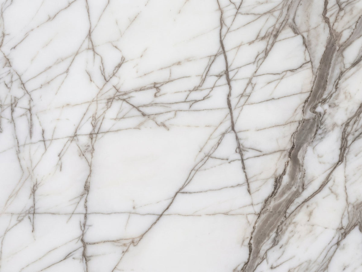 Close-up of the Bovino White Marble Hexagon Side Table: the polished white marble and taupe-grey veins of the top