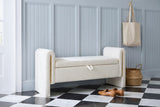 Bracciano cream teddy bench against blue-grey beadboard panelling in a Charleston entry hall with a black-and-white marble floor, a seagrass basket and a pair of loafers
