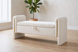 Bracciano cream teddy bench against a pale lime-washed plaster wall in a sunny Los Angeles room with a light oak floor and a potted fiddle-leaf fig