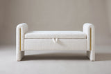 The Bracciano storage bench in cream teddy fabric, straight front view on a light studio backdrop
