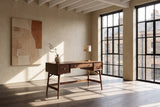 Brancaleone 51.25-Inch 3-Drawer Walnut Veneer Mid-Century Writing Desk in a city loft