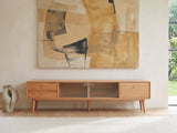 Bressanone Solid Beech Media Console under a large abstract painting in a bright living room