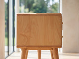 Close-up of the Bressanone Solid Beech Media Console: the end panel of the solid beech case with its rounded edge and the two round tapered legs below