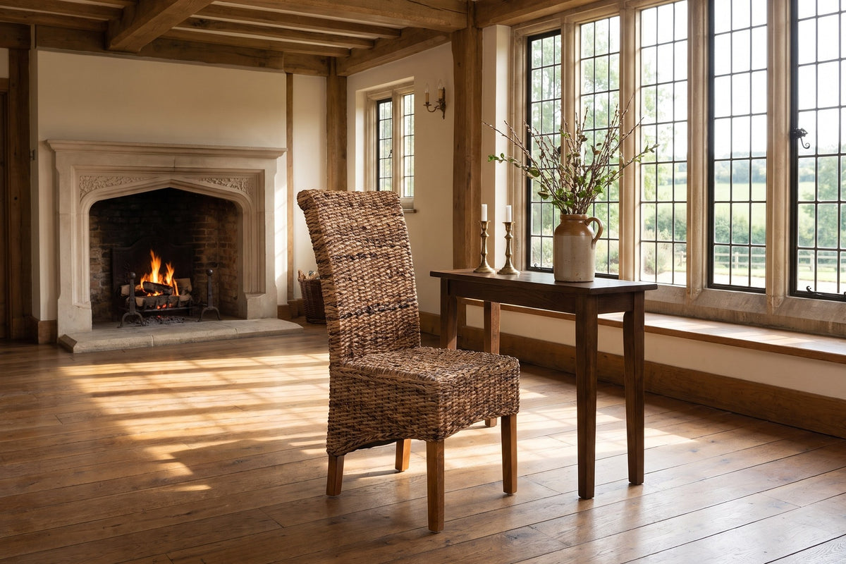 Briatico High-Back Woven Natural Fiber Dining Chair in an English country dining room